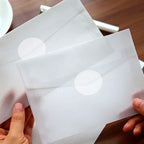 Set of 1000 clear 1-inch round wafer seals by SUMAJU, perfect for envelopes, boxes, and gift packaging in retail or color-coding.