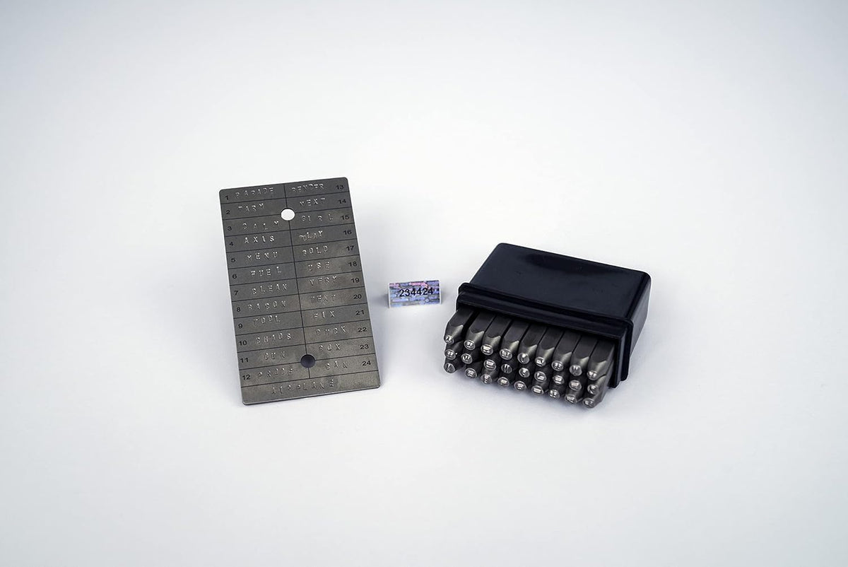 ColdTi titanium Bitcoin seed plates with punch set and seals for secure crypto seed phrase storage, featuring alphabetic punch tools.