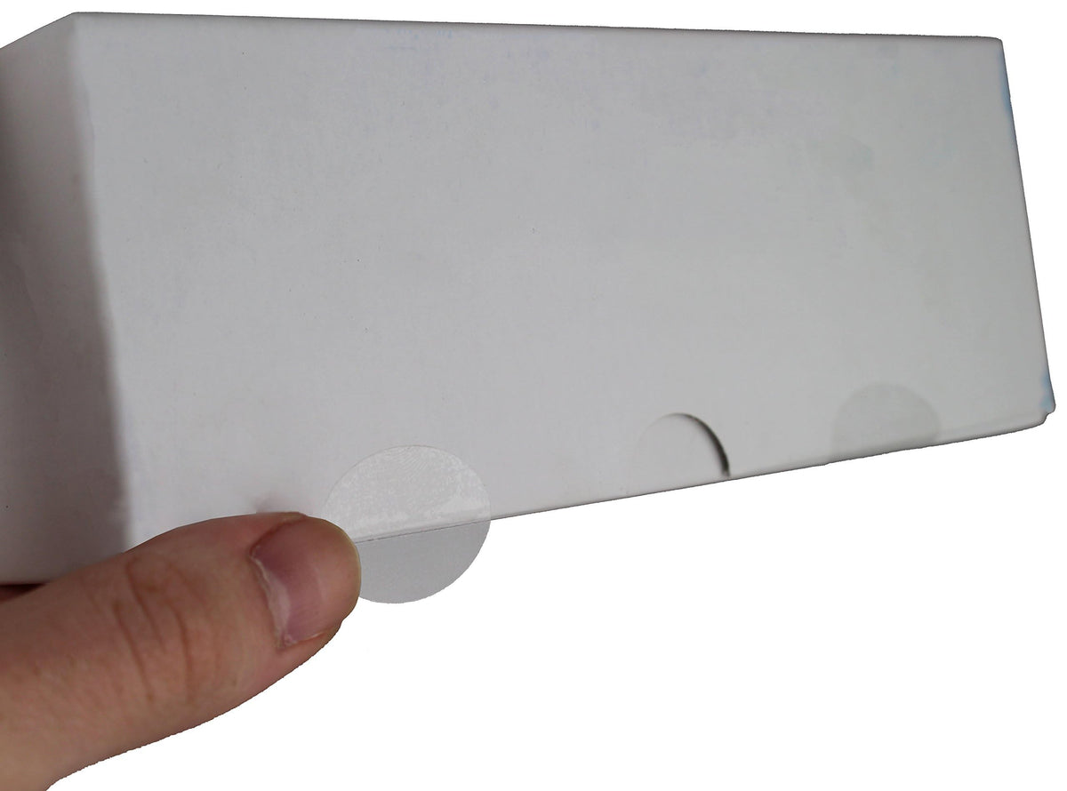 ChromaLabel clear oval wafer seals, 0.75 x 1 inch, perforated labels on roll, shown in close-up image.