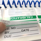 Self-laminating calibration labels by wootile, 1x2 inch write-on industrial stickers for equipment calibration and quality control.