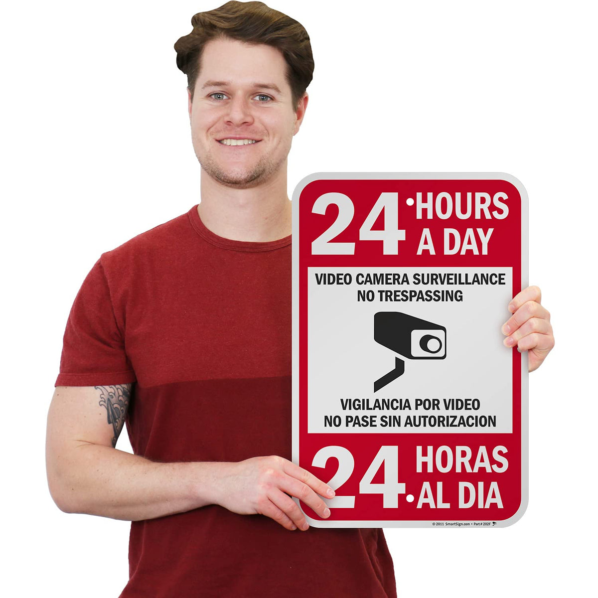 SmartSign 18 x 12 inch “24 Hours A Day - Video Camera Surveillance, No Trespassing, Vigilancia Por Video” Bilingual Metal Sign, 63 mil Laminated Rustproof Aluminum, Red, Black and White 18" x 12"