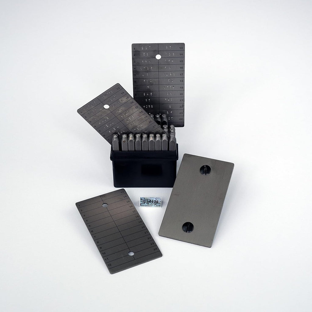 ColdTi titanium Bitcoin seed plates with punch set and seals for secure crypto seed phrase storage, featuring alphabetic punch tools.