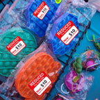 Set of 500 Well Tile red pricemarker labels, 1.8" x 2", for grocery store food pricing and retail labeling.