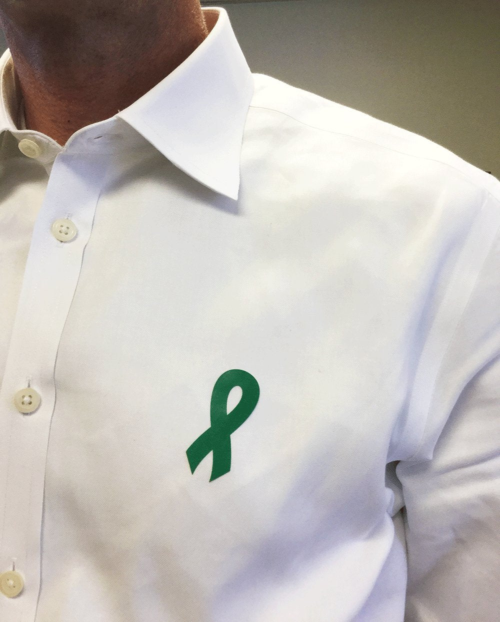 Green awareness ribbon stickers, 2-inch all-purpose adhesive labels by , shown on a white background.