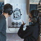 ChromaLabel 1-inch black round target pasters for shooting, 1000 labels per dispenser box, ideal for marksmanship and shooting practice.