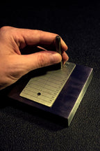 ColdTi titanium Bitcoin seed plates with punch set and seals for secure crypto seed phrase storage, featuring alphabetic punch tools.
