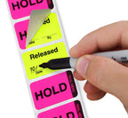 ChromaLabel fluorescent pink and yellow double-layer quality control labels, 1x1.5 inches, imprinted with Hold and Released, in a dispenser box.