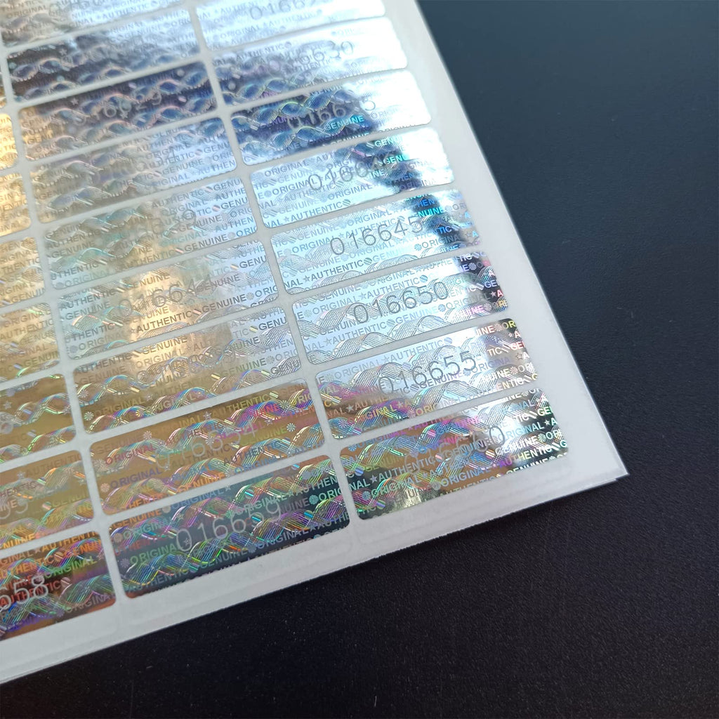 All-purpose silver hologram tamper-proof security labels with serial numbers, designed to verify authenticity and prevent tampering.