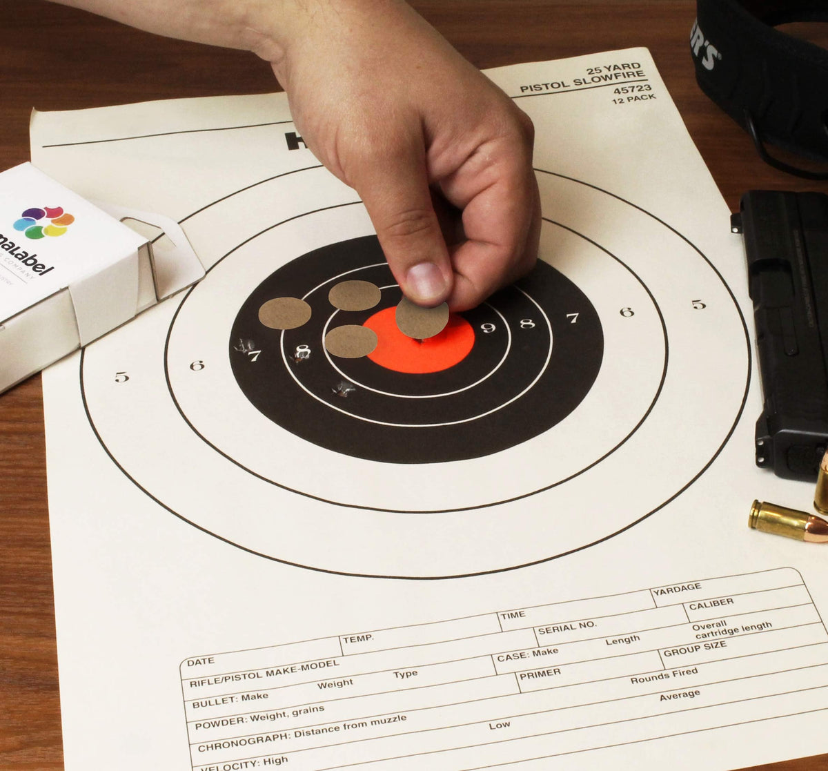 ChromaLabel 0.75 inch round kraft target pasters for shooting, 1000 labels per dispenser box, ideal for marksmanship and training.