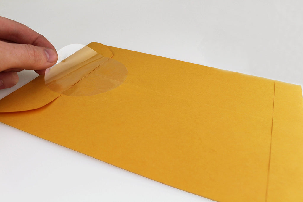 ChromaLabel 3-inch clear round wafer seals, all-purpose labels on a roll, showing transparent adhesive labels for various uses.