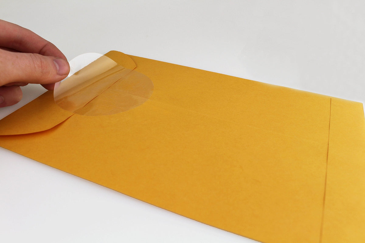 ChromaLabel 3-inch clear round wafer seals, all-purpose labels on a roll, showing transparent adhesive labels for various uses.