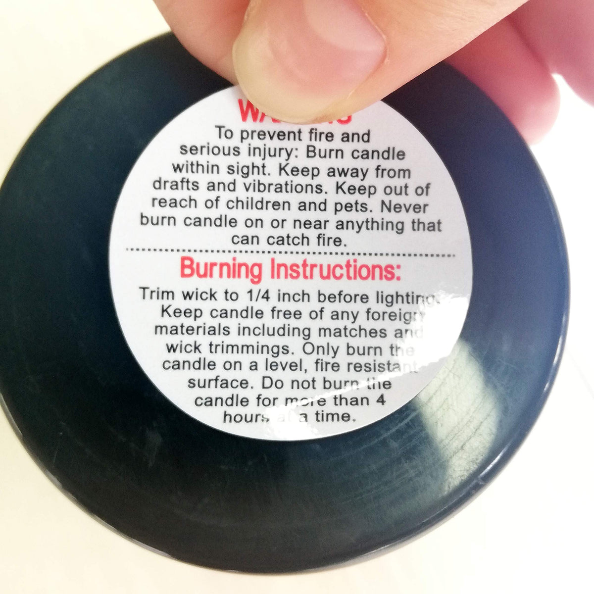 Set of 500 waterproof 1.5-inch candle warning labels for soy wax candle jars, tins, and votives by Pop Resin.
