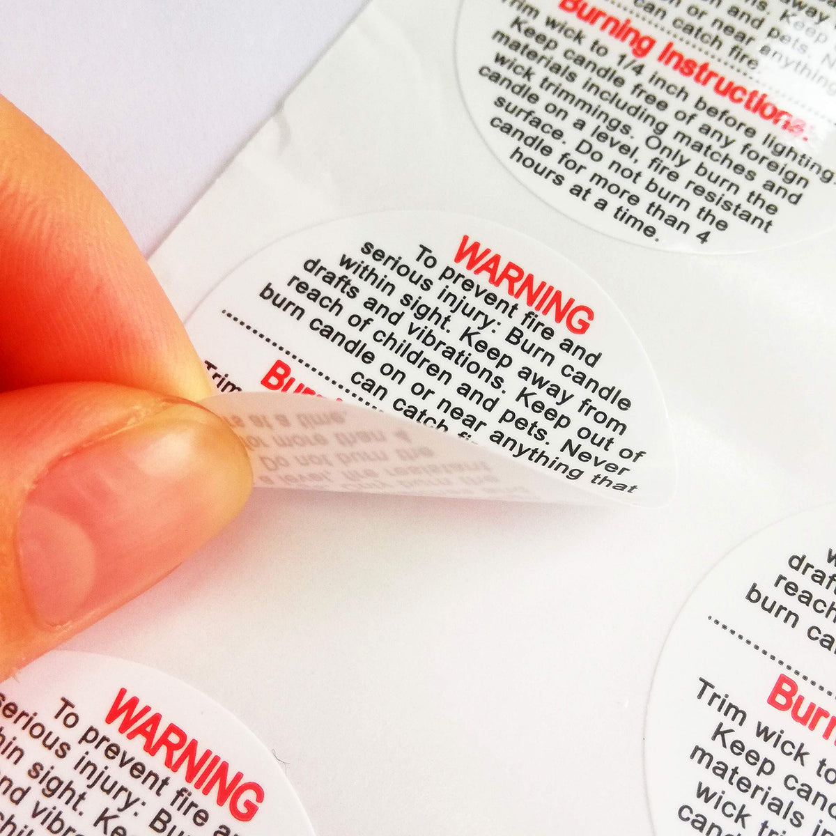 Set of waterproof 1.5-inch Candle Warning Labels by Pop Resin for candle jars, tins, and votives, with 500 safety sticker decals.