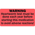 Red heartworm test warning veterinary label on a roll, 2x1 inches, used for cages, records, and prescription bottles in clinics.