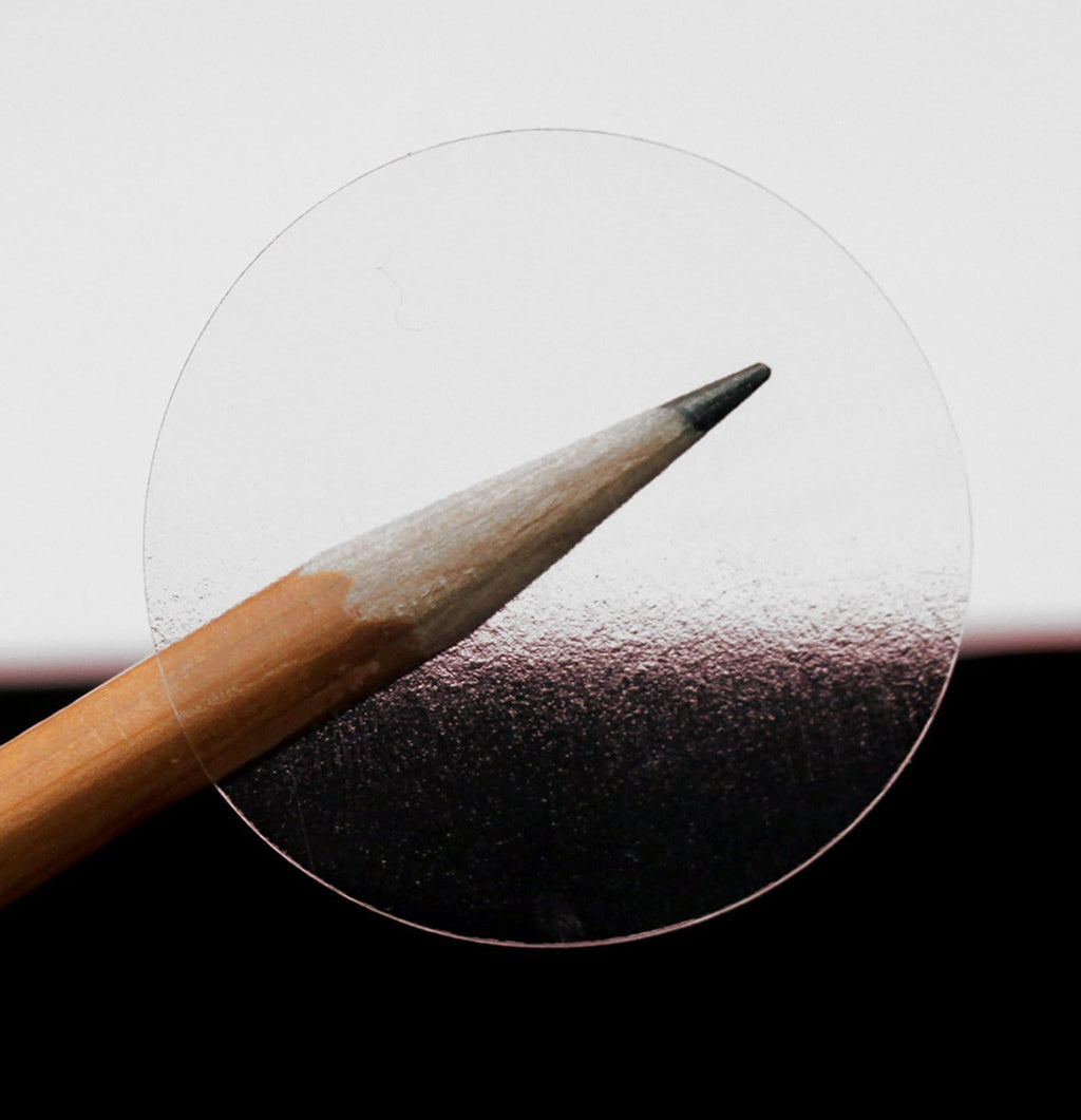 ChromaLabel 1.50 inch round clear wafer seals for all-purpose labeling, non-perforated, 500 per roll, transparent adhesive labels.