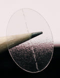 ChromaLabel clear oval wafer seals, 0.75 x 1 inch, perforated labels on a roll, ideal for packaging and sealing purposes